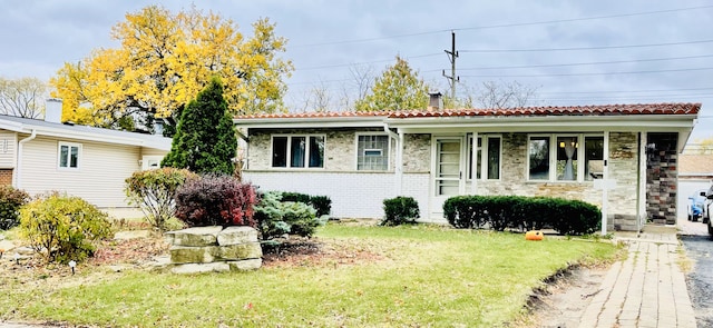 single story home with covered porch and a front yard