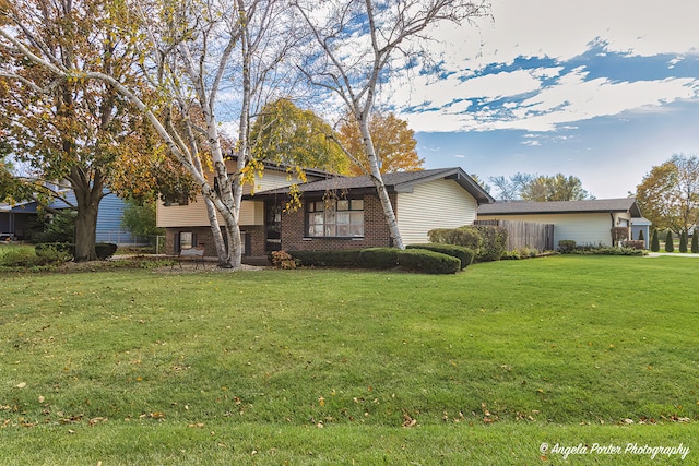 tri-level home featuring a front yard