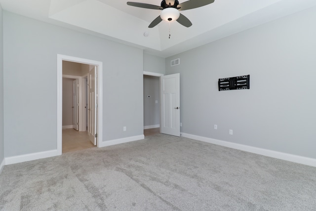 unfurnished bedroom with ceiling fan and light colored carpet