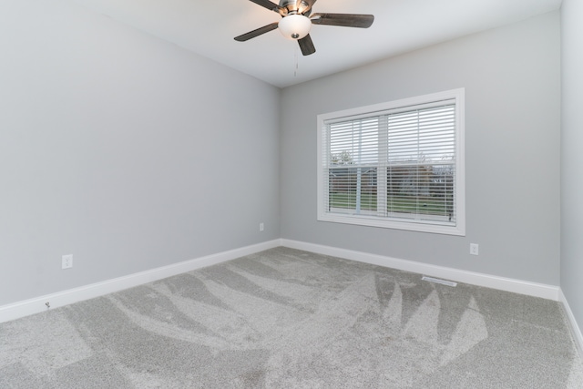 unfurnished room featuring carpet and ceiling fan