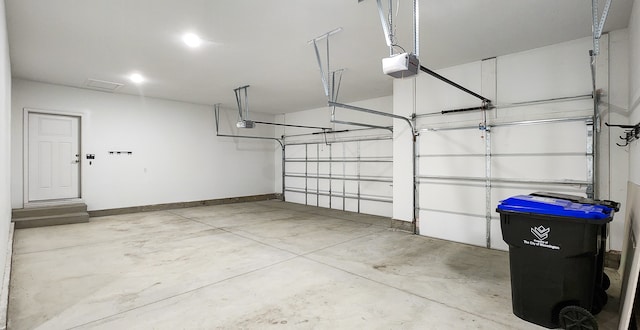 garage featuring a garage door opener