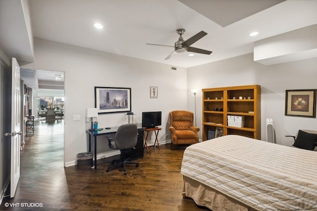 bedroom with ceiling fan and dark hardwood / wood-style flooring