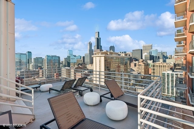 view of patio featuring a balcony