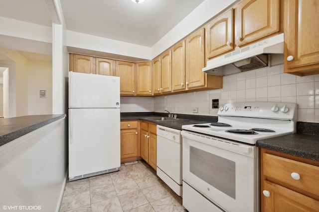 kitchen featuring tasteful backsplash, sink, and white appliances