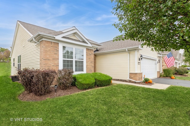 single story home featuring a garage and a front yard