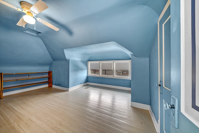 bonus room with ceiling fan, wood-type flooring, and lofted ceiling