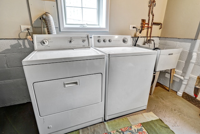 washroom with washer and dryer