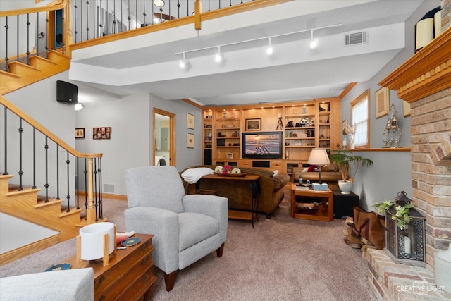 living room featuring light carpet and rail lighting