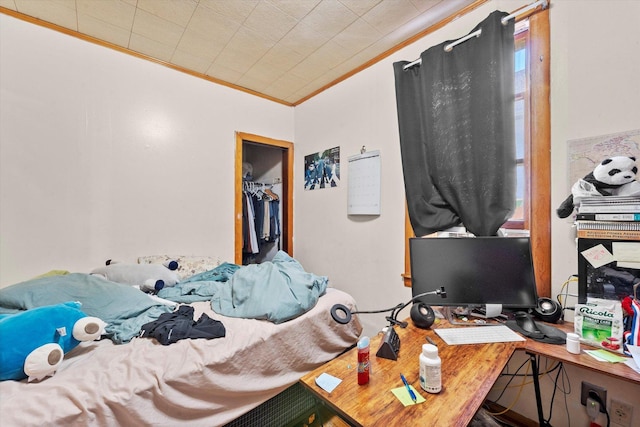 2425 W 46th Pl, Chicago, IL 60632 - bedroom featuring ornamental molding, an office area, and a spacious closet