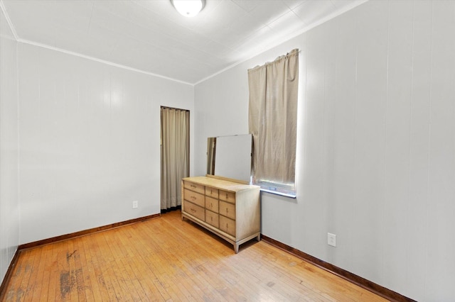 2425 W 46th Pl, Chicago, IL 60632 - unfurnished bedroom with light wood-type flooring, baseboards, and crown molding