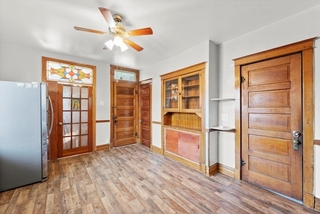 2425 W 46th Pl, Chicago, IL 60632 - entrance foyer featuring ceiling fan, light wood-style flooring, and baseboards