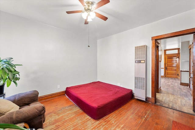 2425 W 46th Pl, Chicago, IL 60632 - bedroom featuring a heating unit, hardwood / wood-style floors, baseboards, pool table, and ceiling fan