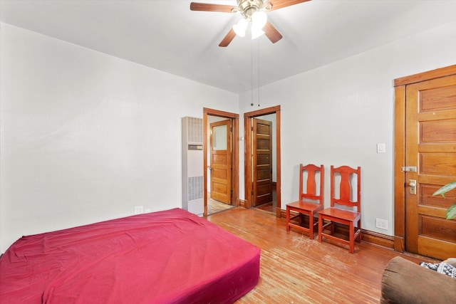 2425 W 46th Pl, Chicago, IL 60632 - bedroom with a heating unit, light wood-style flooring, and a ceiling fan