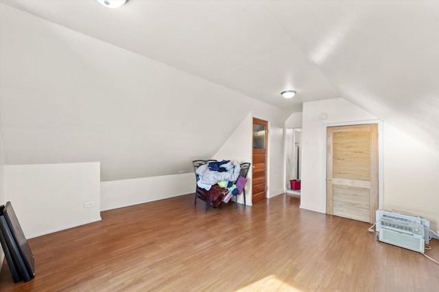 2425 W 46th Pl, Chicago, IL 60632 - bonus room featuring lofted ceiling, wood finished floors, and baseboards