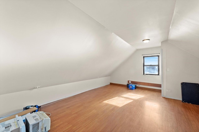 2425 W 46th Pl, Chicago, IL 60632 - additional living space with light wood-style floors, lofted ceiling, and baseboards