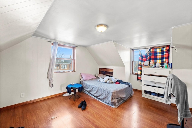 2425 W 46th Pl, Chicago, IL 60632 - bedroom featuring wood finished floors, vaulted ceiling, and baseboards