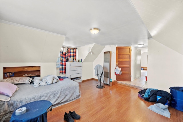 2425 W 46th Pl, Chicago, IL 60632 - bedroom with a heating unit, wood finished floors, and lofted ceiling