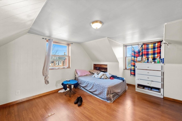 2425 W 46th Pl, Chicago, IL 60632 - bedroom featuring wood finished floors, lofted ceiling, and baseboards