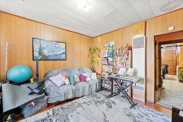 2425 W 46th Pl, Chicago, IL 60632 - living room featuring a heating unit, wooden walls, wood finished floors, and ornamental molding