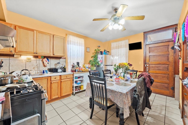2425 W 46th Pl, Chicago, IL 60632 - kitchen featuring appliances with stainless steel finishes, light brown cabinetry, ceiling fan, tasteful backsplash, and light countertops