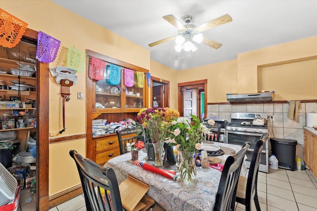 2425 W 46th Pl, Chicago, IL 60632 - dining area featuring light tile patterned floors and ceiling fan