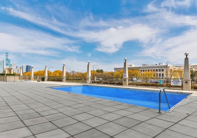 view of swimming pool featuring a patio area