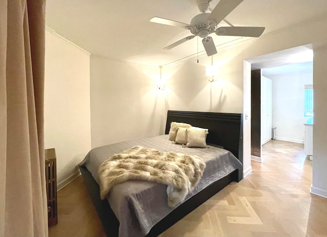 bedroom featuring ceiling fan and crown molding