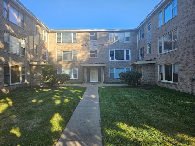 view of community featuring a lawn