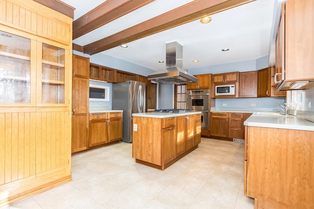 kitchen with island range hood, stainless steel appliances, sink, beamed ceiling, and a center island