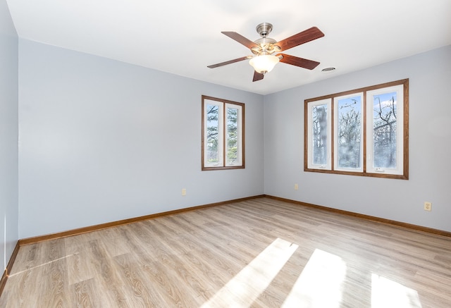 unfurnished room with ceiling fan and light hardwood / wood-style flooring