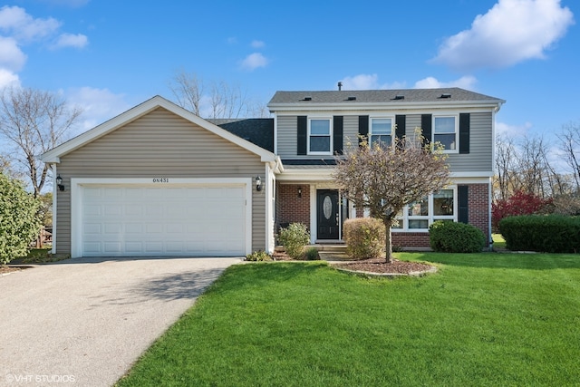 view of front of house with a garage and a front yard