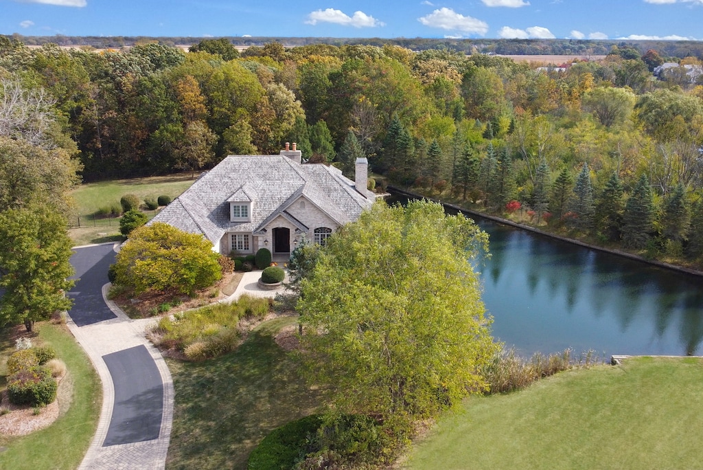 drone / aerial view with a water view