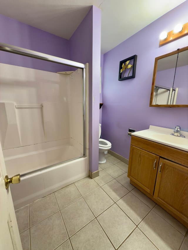 full bathroom with toilet, washtub / shower combination, vanity, and tile patterned floors