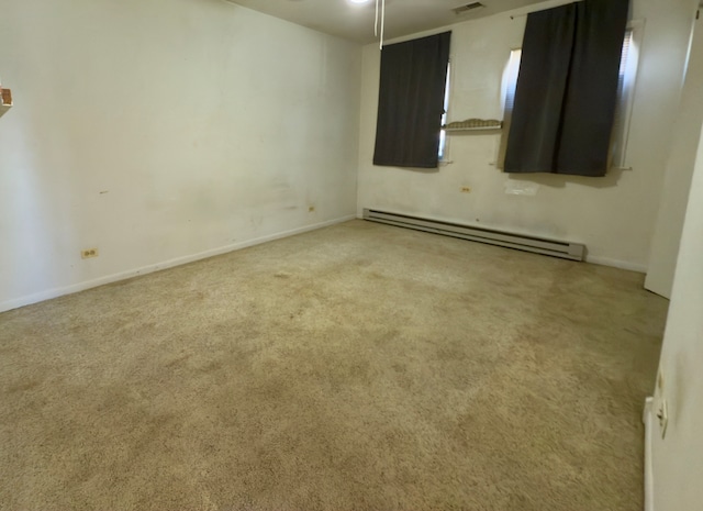 carpeted empty room with a baseboard radiator