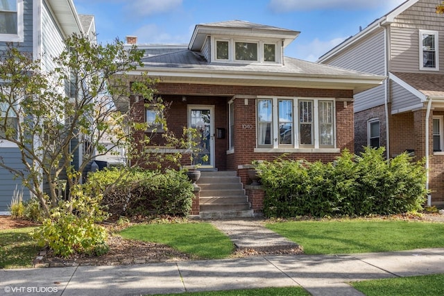 bungalow with brick siding