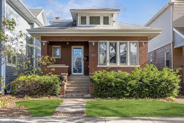 bungalow with brick siding