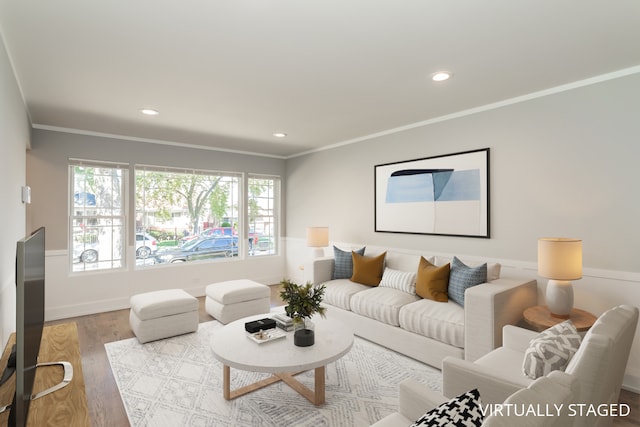 living room featuring ornamental molding and light wood-type flooring