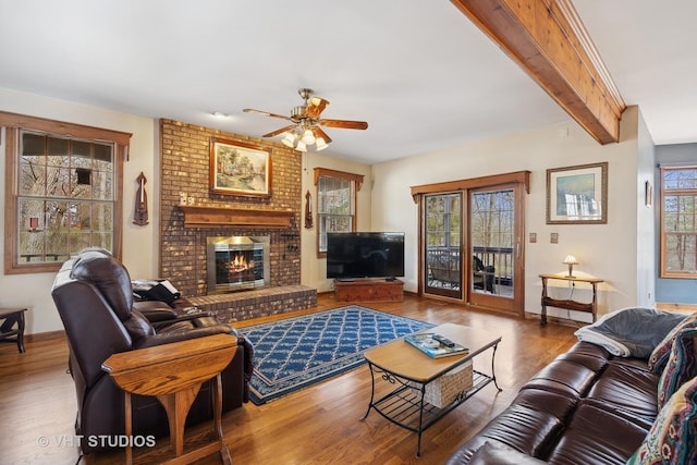 2418 Bennington Ln, Mchenry, IL 60050 - living room featuring ceiling fan, wood finished floors, a fireplace, baseboards, and beam ceiling