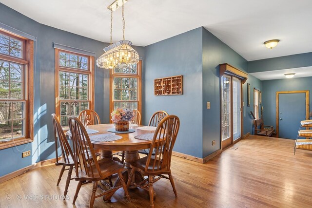 2418 Bennington Ln, Mchenry, IL 60050 - dining room featuring wood finished floors, baseboards, and a chandelier