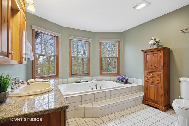 2418 Bennington Ln, Mchenry, IL 60050 - full bath with toilet, a garden tub, vanity, and tile patterned flooring