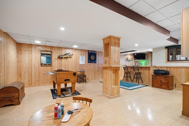 2418 Bennington Ln, Mchenry, IL 60050 - playroom featuring light wood-style floors, a paneled ceiling, wood walls, and bar