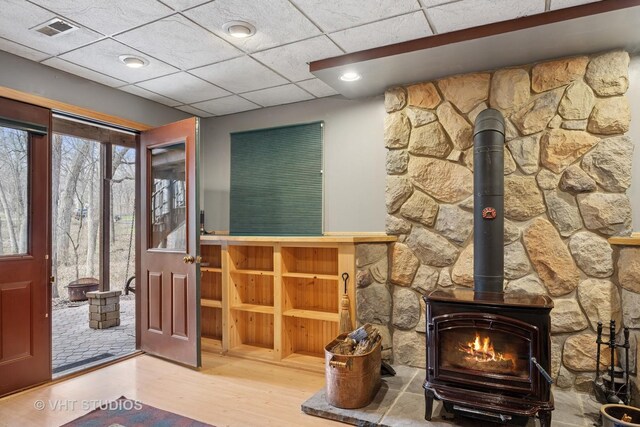 2418 Bennington Ln, Mchenry, IL 60050 - foyer featuring a wood stove, wood finished floors, and a paneled ceiling