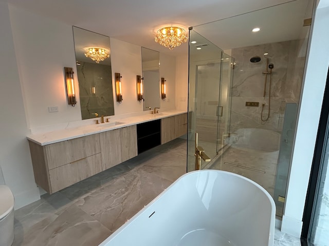 bathroom featuring vanity, plus walk in shower, and a chandelier