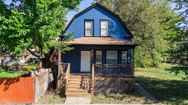 view of front of home featuring a front yard and covered porch