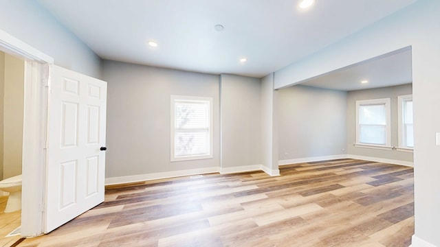 empty room with light hardwood / wood-style floors