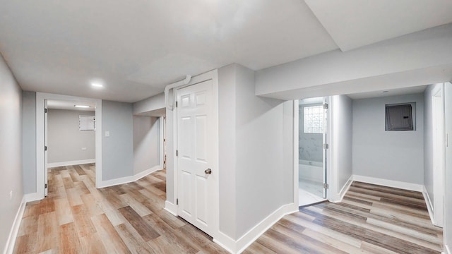 interior space featuring light wood-type flooring and electric panel