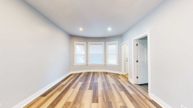 empty room with light wood-type flooring