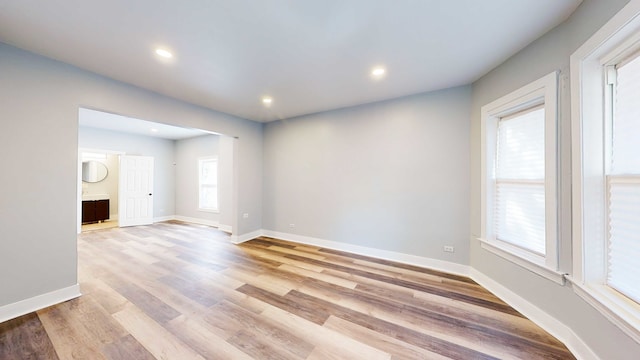 unfurnished room featuring light wood-type flooring