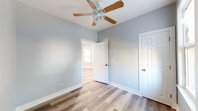 unfurnished bedroom with light hardwood / wood-style floors and ceiling fan