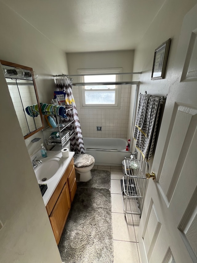 full bathroom with toilet, shower / bath combo, vanity, and tile patterned floors